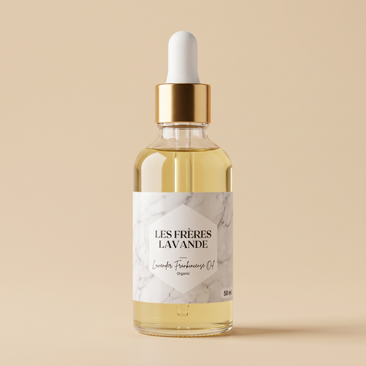 Lavender & Frankincense Oil 50 ml bottle on a warm resin beige background